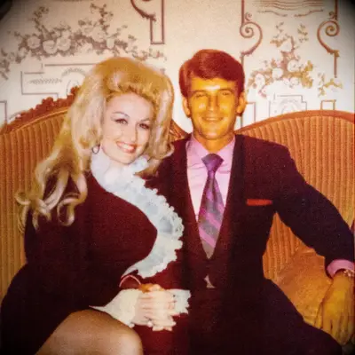 Dolly and Carl sitting on couch 