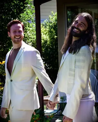 Jonathan Van Ness and Mark Peacock holding hands