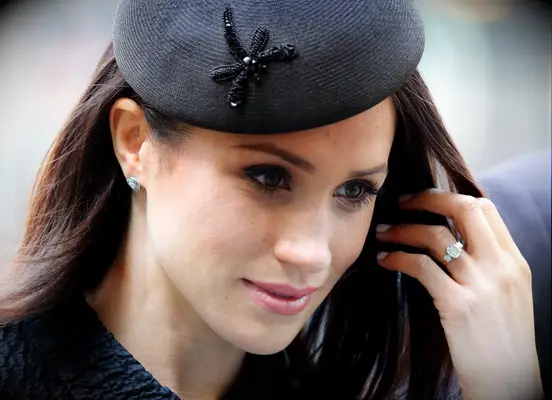 Meghan Markle shows off her classic diamond engagement ring. 