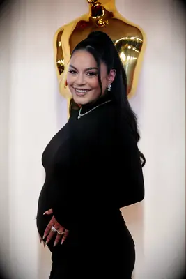 Vanessa Hudgens cradling her baby bump at the Oscars 