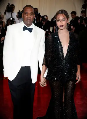 Beyonce and Jay-Z pictured hand in hand on the red carpet at the Met Gala. 