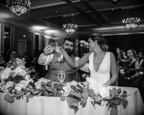 Jason and Kylie Kelce toasting on their wedding day