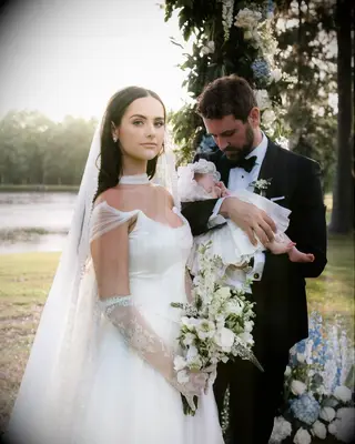 Natalie Joy wearing basque wedding dress on wedding day with Nick Viall, 2025 celebrity wedding trends