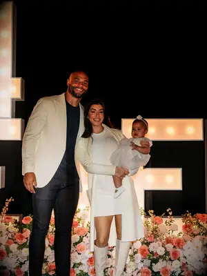 Dak Prescott with his fiancée and daughter