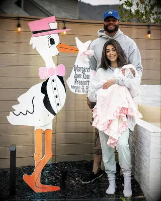 Dak Prescott with his girlfriend and daughter