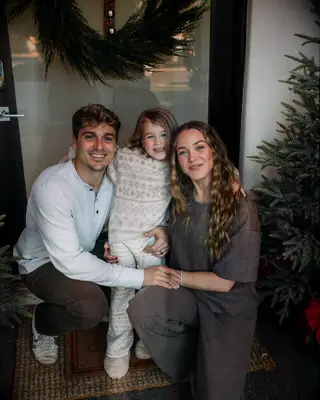 Kike and Mariana with their child