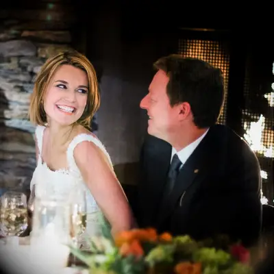 Savannah Guthrie and husband Michael Feldman smiling at each other