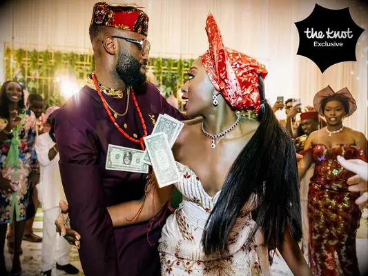 Chiney and husband Raphael doing the money dance at their wedding reception