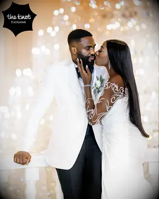 Chiney and Raphael kissing at their wedding 