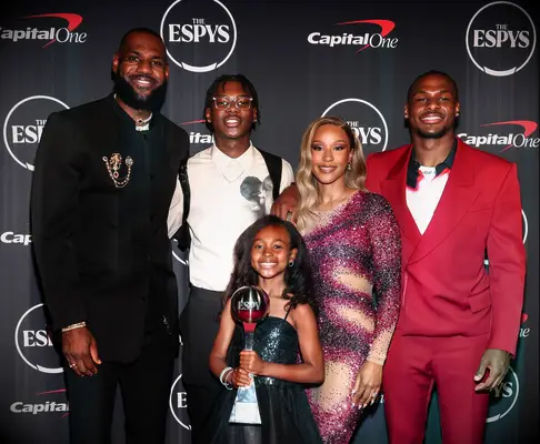 LeBron James and Savannah James with children