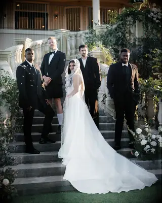 Kirstin Maldonado and the rest of pentatonix posing at wedding