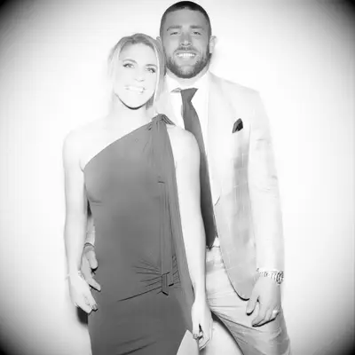 Black and white photo of Zach and Julie Ertz smiling for the camera