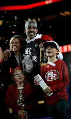 Kyle Shanahan and his wife with their kids