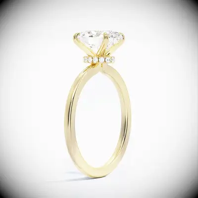 Oval-cut engagement ring on a gold band with a hidden halo