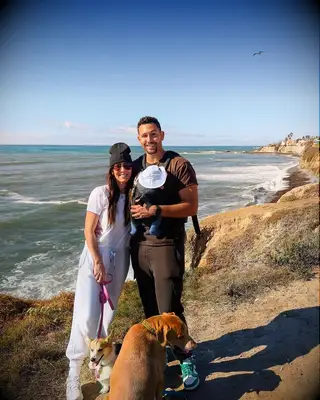 Becca Kufrin and Thomas Jacobs with their son