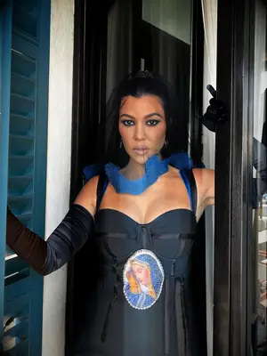 Kourtney Kardashian wedding black dress with image of Mother Mary