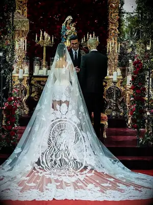 Kourtney Kardashian wedding veil during ceremony with Travis Barker