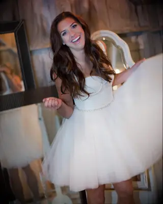 Alex Morgan in the custom Amsale mini dress she wore at her wedding reception