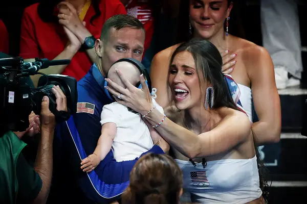 Caeleb Dressel with wife Meghan and son August at the 2024 Olympics in Paris
