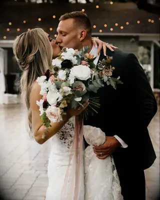Meghan Dressel and Caeleb Dressel kissing on wedding day
