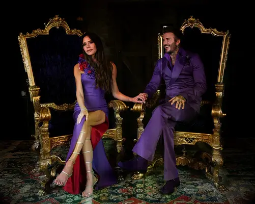 Victoria and David Beckham in their wedding reception outfits 