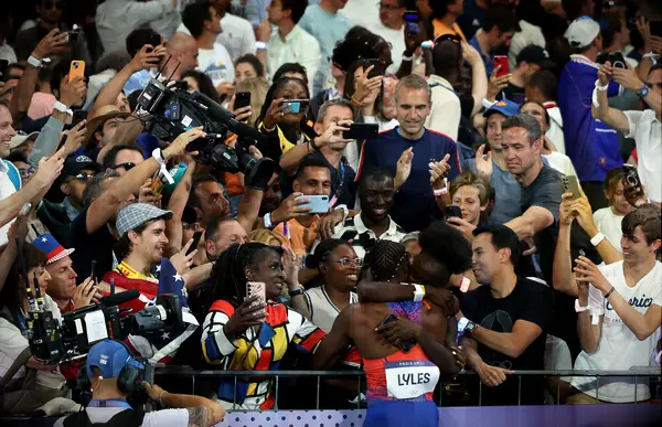 Noah Lyles and his girlfriend Junelle Bromfield celebrating his Olympic gold medal win