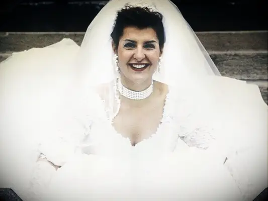 Toula from My Big Fat Greek Wedding smiling on on her wedding day 