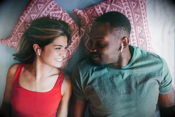 Couple at home listening to music together