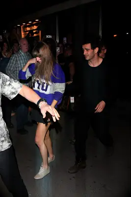 Taylor Swift and Matty Healy walking together in 2023