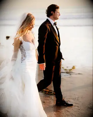 Gerrit Cole and wife Amy holding hands on their wedding day