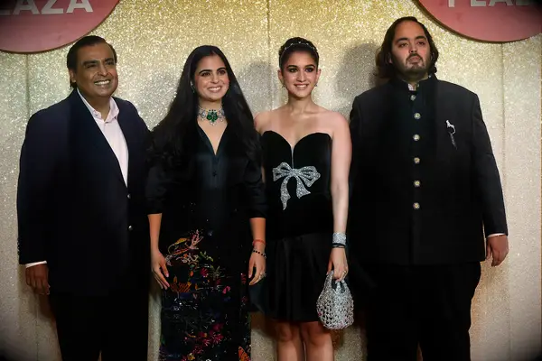 Chairman and Managing Director of Reliance Industries, Indian billionaire businessman Mukesh Ambani (L) with his daughter Isha Ambani (2L), son Anant Ambani (R) and Radhika Merchant (2R) attend the launch of the 