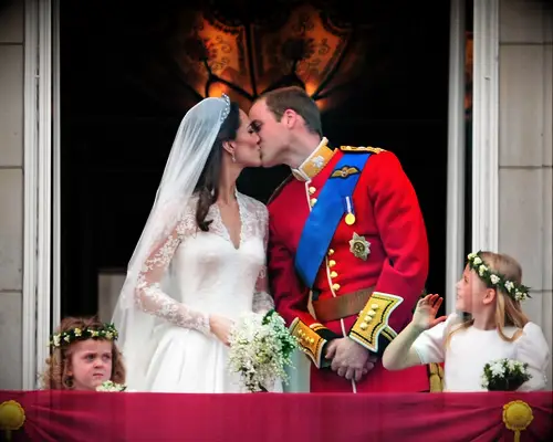 William and Kate share a kiss on the balcony. 