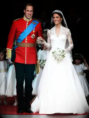 William and Kate hold hands on their wedding day. 