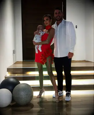 Brooks Koepka and wife Jena Sims with their son Crew