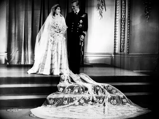 Queen Elizabeth wedding dress picture with veil laid out on wedding day with Prince Phillip