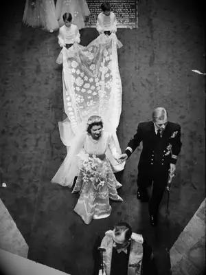 Aerial photo of Queen Elizabeth and Prince Phillip on wedding day walking through Westminster Abbey