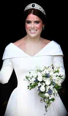 Princess Eugenie wears a tiara with an emerald in the center. 