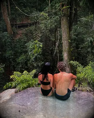 Gavin and Cheyanne Casalegno sitting on a rock together 