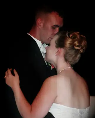 Rebecca Yarros and husband on wedding day