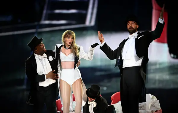 Travis Kelce on stage at the Eras Tour in London