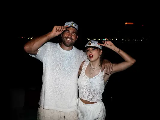 Travis Kelce and Taylor Swift in matching hats