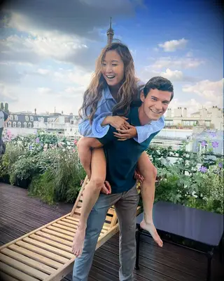 Paul Forman and girlfriend Ashley Parks smiling with each other