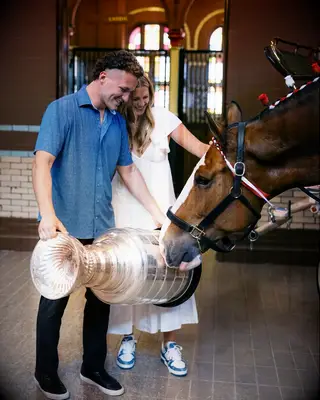 Matthew Tkachuk and fiancé Ellie Connell with the Stanley Cup trophy