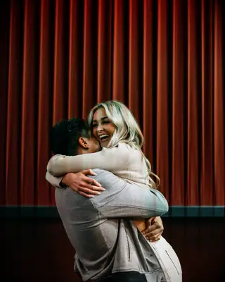 Brandon and Brylee Armstrong hugging after proposal