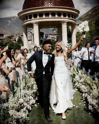 Brandon and Brylee Armstrong walking down aisle at wedding