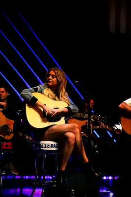 Kelsea Ballerini performing with her guitar in Chicago, Illinois
