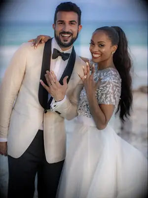 Bachelorette Rachel Lindsay and Bryan Abasolo showing rings on wedding day