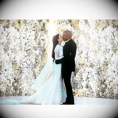 Kim Kardashian and Kanye West kissing on wedding day