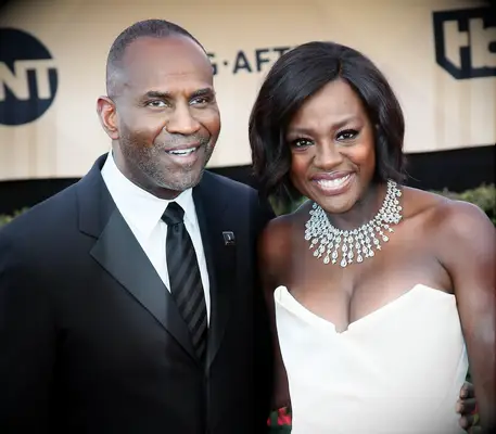 Viola Davis and Julius Tennon smile for the camera. 