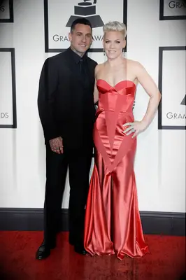 Pink and Carey Hart pose on the red carpet. 